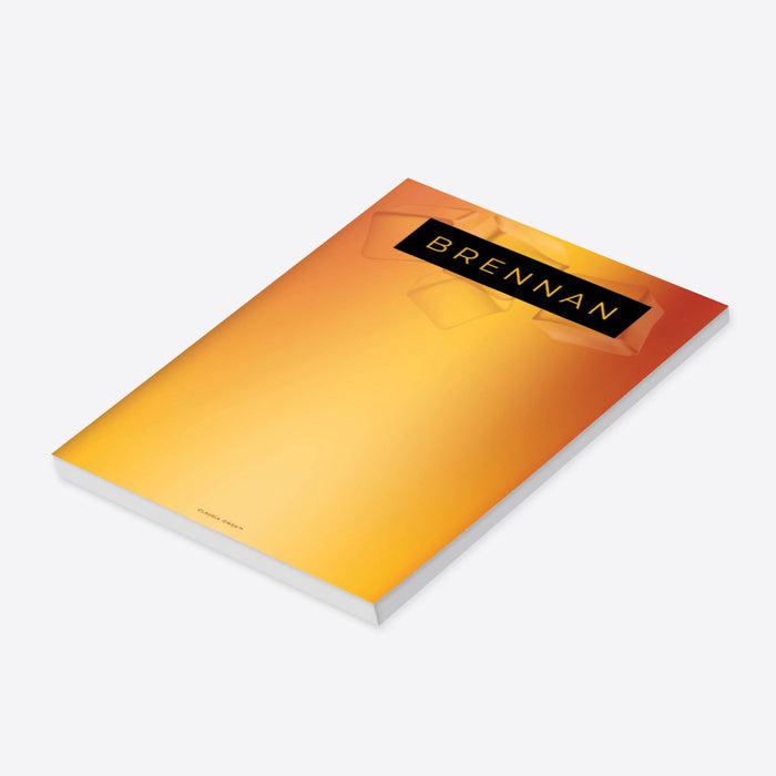 Whiskey-themed personalized notepad featuring an amber gradient, ice cube details, and a black nameplate, ideal as a gift, party favor, or event keepsake.-side