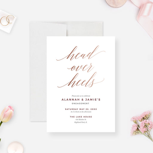 Head Over Heels engagement invitation with flowing script lettering and a clean white background.