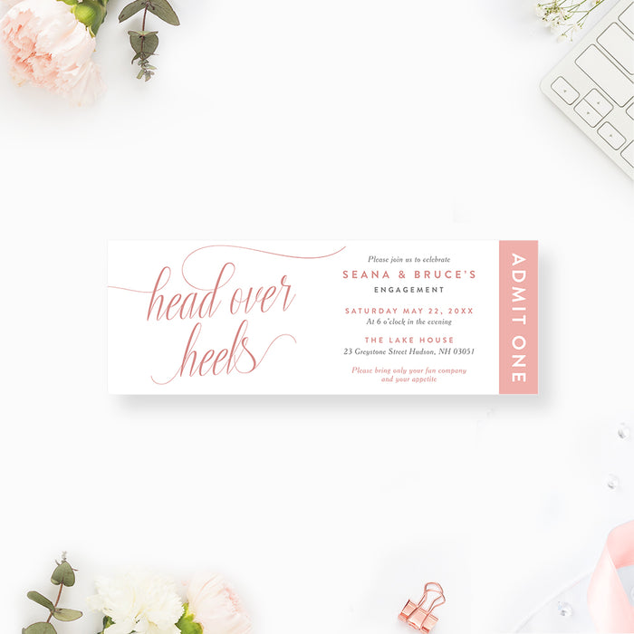 Blush engagement ticket invitation with “head over heels” script and elegant minimalist layout