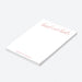 Personalized blush notepad featuring “head over heels” script with couple’s name at the bottom in elegant lettering-side