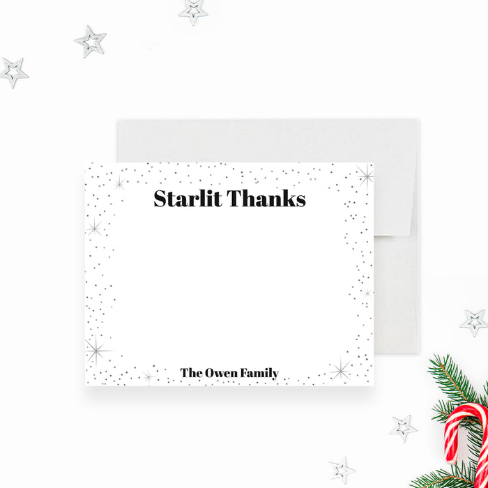 personalized holiday thank you card with black and white starry design, Starlit Thanks lettering, and custom family name-front