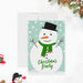 a christmas card with a snowman wearing a hat and scarf