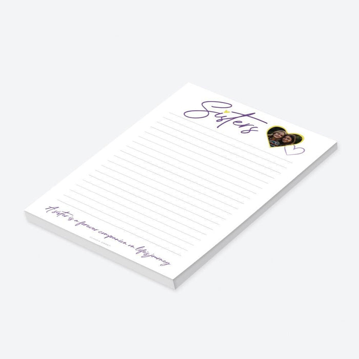 a notepad with a picture of a woman on it