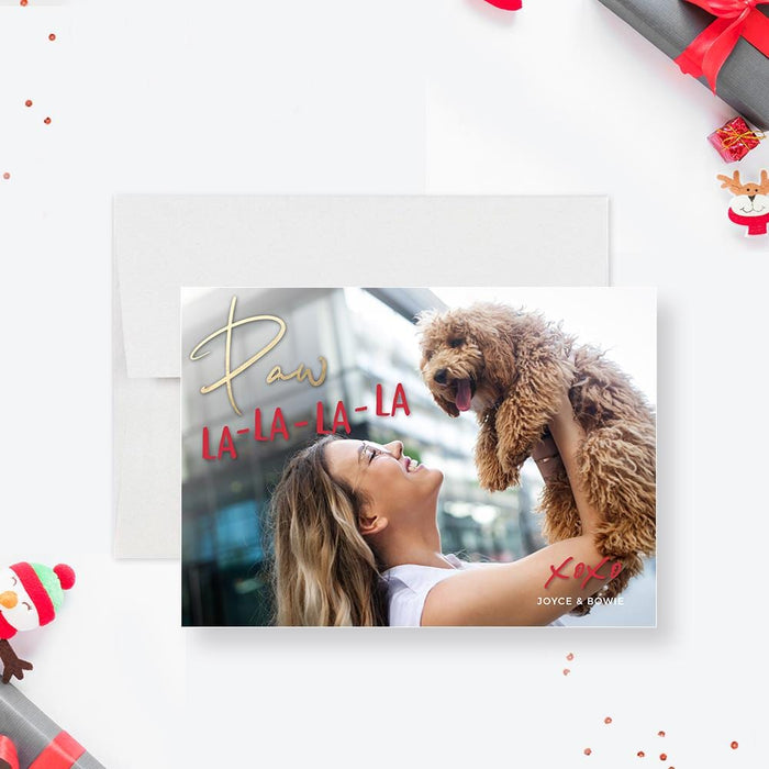 a woman holding a dog on top of a christmas card