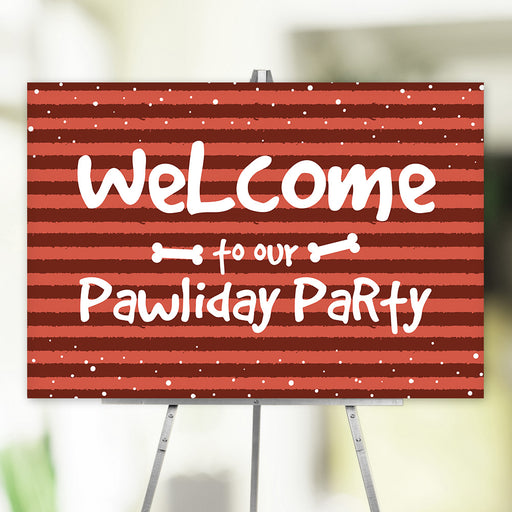 Red-striped pawliday party welcome sign with playful white lettering, snow dots, and bone accents, perfect for pet-friendly holiday celebrations.
