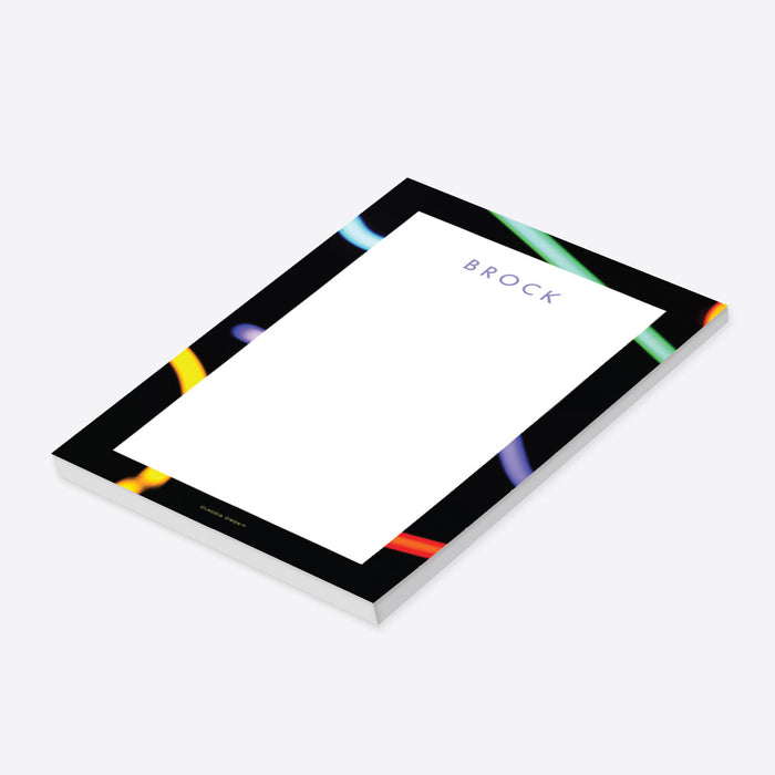 Personalized neon notepad featuring a glow-stick design, colorful kids' stationery for glow-themed parties-side
