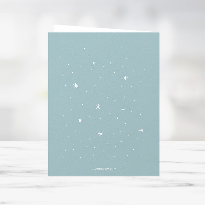 Holiday photo card template featuring  snowflake background 