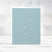 Holiday photo card template featuring  snowflake background 