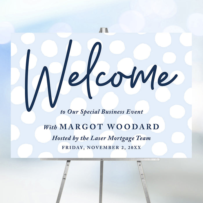 corporate special event welcome sign with light blue dot design, navy lettering, and custom business event details displayed on an easel
