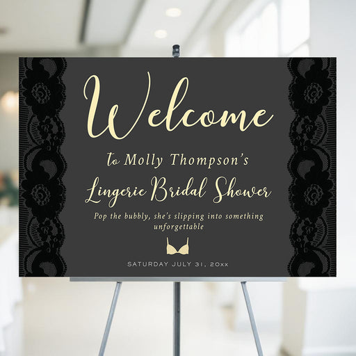 Personalized bridal shower welcome sign featuring black lace design and elegant lettering, displayed on an easel.
