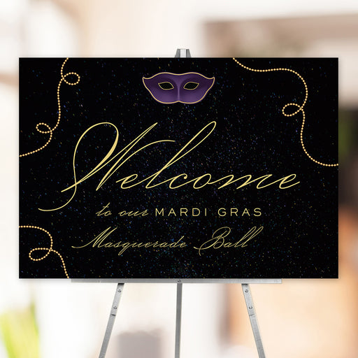Elegant Mardi Gras masquerade ball welcome sign featuring a black background with gold script, purple mask graphic, and gold bead accents.