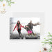 Merry Christmas photo card featuring a full-bleed family photo, white snowflake border, gold script accents and classic holiday typography on a winter-themed layout.