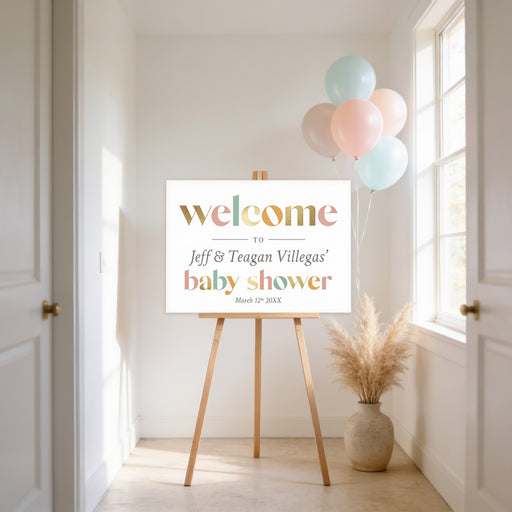 Baby shower welcome sign on an easel with balloons in a bright room.