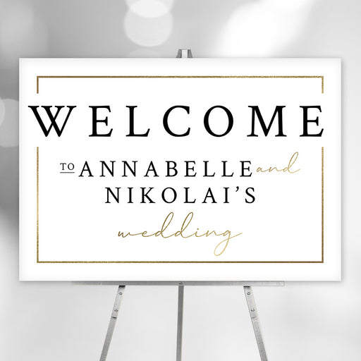 Elegant personalized wedding welcome sign featuring the couple’s names and gold accents, displayed on an easel as event entrance decor.