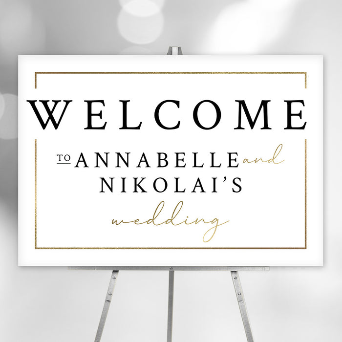 Elegant personalized wedding welcome sign featuring the couple’s names and gold accents, displayed on an easel as event entrance decor.