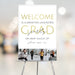 Graduation welcome sign for Class of 2026 with photo collage displayed on easel, modern party entrance decor