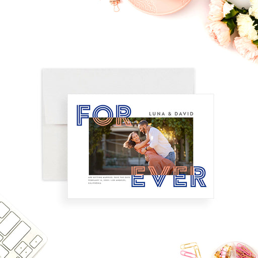 Modern photo save the date card featuring bold blue and orange typography with a couple’s engagement photo in a clean minimalist layout.-front