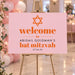 A personalized pink and orange Bat Mitzvah welcome sign featuring a Star of David, perfect for displaying at the entrance on her special day.