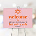 A personalized pink and orange Bat Mitzvah welcome sign featuring a Star of David, perfect for displaying at the entrance on her special day.