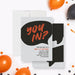 modern birthday party invitation with black speech bubble design, orange lettering, gray background, and personalized party details-front-back