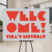 modern birthday party welcome sign with bold red lettering, gray background, and personalized birthday party wording displayed on an easel