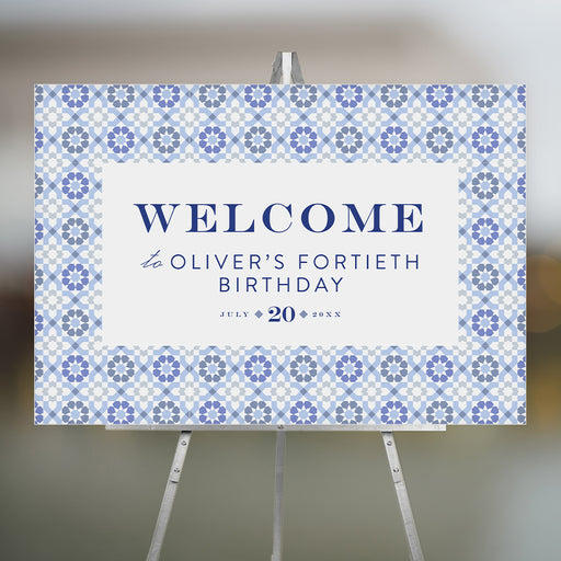 Elegant Mediterranean blue tile welcome sign with navy text on an easel, personalized for birthdays, weddings, or milestone events.
