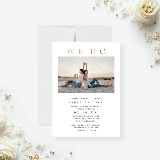 Modern wedding invitation featuring a couple photo, a white minimalist design, and gold “We Do” typography-front