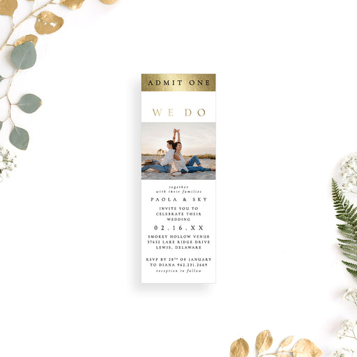 Ticket-style wedding invitation featuring a couple photo and a personalized white and gold printed event entry pass.