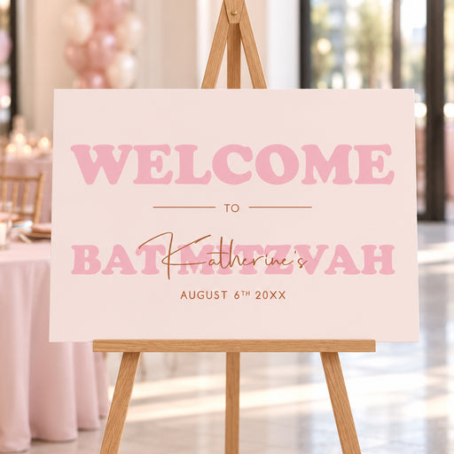 Blush pink Bat Mitzvah welcome sign, displayed on an easel for a girl’s milestone celebration.