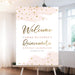 Pink and gold quinceañera welcome sign with watercolor accents and gold confetti displayed on an easel for a Sweet 15 celebration.