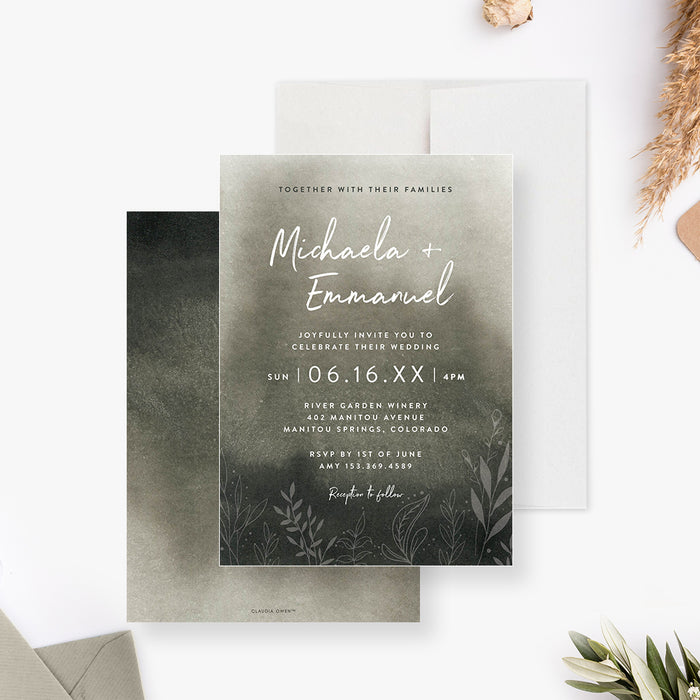moody botanical wedding invitation with soft watercolor background, white script lettering, and delicate foliage details along the bottom-front-back