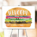 Burger-themed birthday welcome sign showcasing a watercolor-style hamburger customized with your party details.