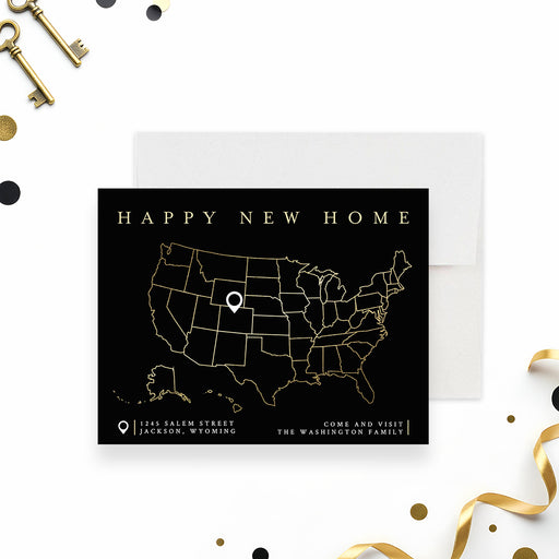 new home moving announcement card with black background, gold-colored U.S. map, location marker, family name, and personalized address details-front
