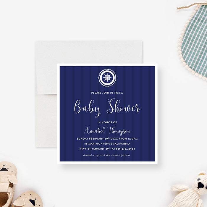 nautical baby shower invitation with navy blue background, ship wheel emblem, and elegant white lettering-front