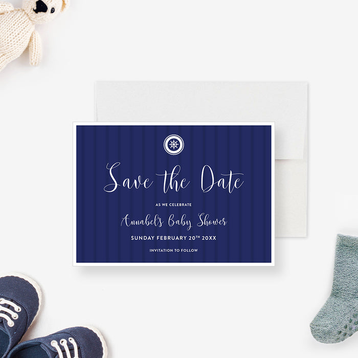 nautical baby shower save the date card with navy blue background, ship wheel emblem, and white script lettering-front