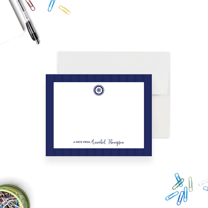 personalized nautical baby shower thank you card with navy blue border, ship wheel emblem, and custom name-front