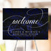 Navy blue rehearsal dinner welcome sign with modern calligraphy typography