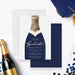 navy champagne bottle graduation party invitation with elegant script lettering, gold-colored accent details, tassels, and personalized event wording-front-back