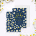 Daisy baby shower invitation with boho floral spring design on navy background, perfect for baby in bloom or spring newborn celebrations.