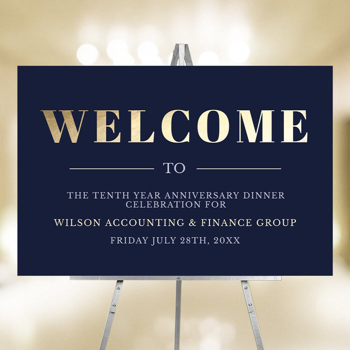 Navy blue welcome sign with a gold Welcome heading, displayed on an easel.