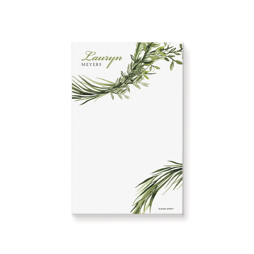 Personalized notepad with botanical greenery design and custom name in elegant lettering