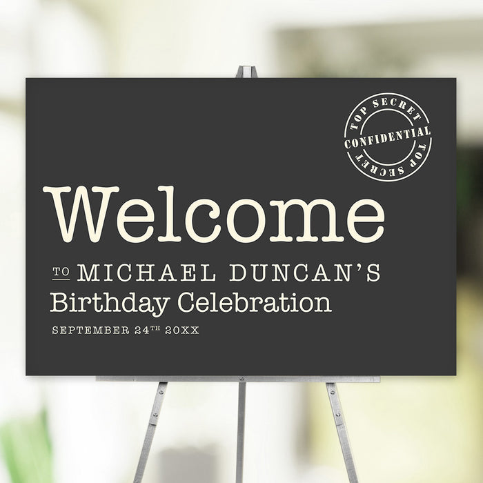 Birthday welcome sign with “Top Secret” stamp, personalized with name and date, displayed on an easel for party entrance décor