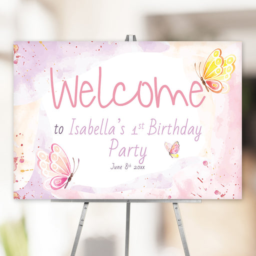 Personalized birthday party welcome sign with soft pastel watercolor butterflies for a girl’s first birthday party