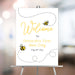 Honey bee birthday welcome sign with cute bee illustrations, dotted flight paths, and yellow script text for a first birthday party.