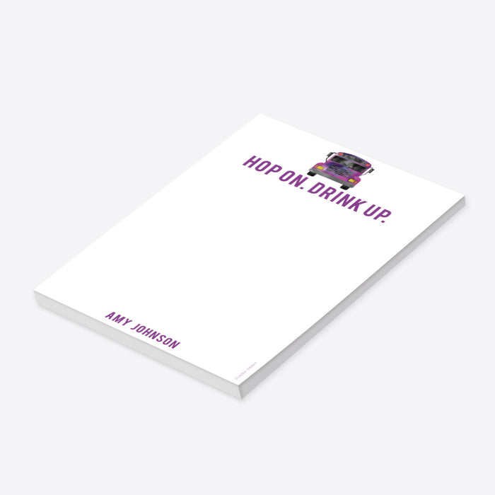 Personalized notepad featuring a watercolor party bus illustration and the “Hop On. Drink Up.” tagline-side