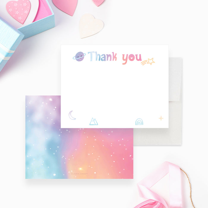 Pastel thank you note card with small planets, stars and a crescent moon and a colorful celestial reverse.