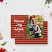 red striped holiday card reading paws joy love and a photo section showing people outdoors with a dog