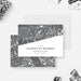 Personalized 50th birthday save the date card with black and white bokeh design, name, celebration date, and personalized wording-front-back