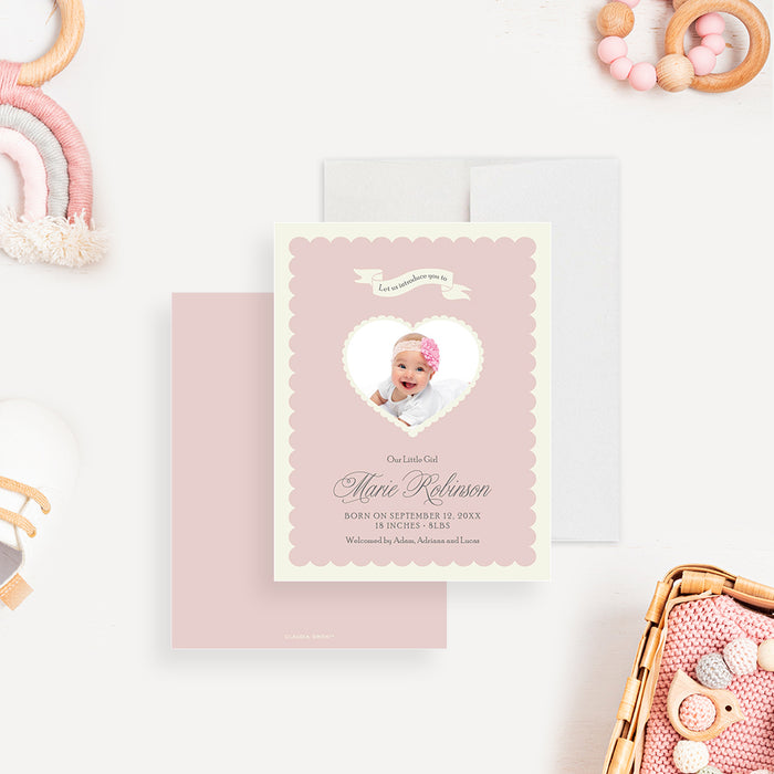 Blush pink baby announcement card with a heart-shaped photo cutout, personalized with the baby’s name and birth details.-front-back