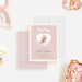 Blush pink baby announcement card with a heart-shaped photo cutout, personalized with the baby’s name and birth details.-front-back